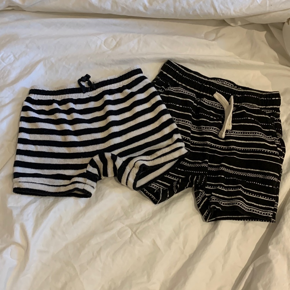 Two pairs of black and white shorts